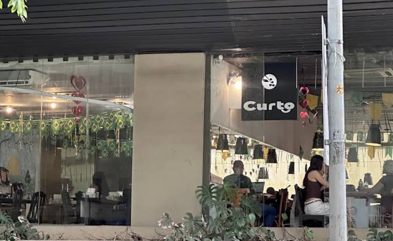 The storefront and covered patio seating at Curto Café